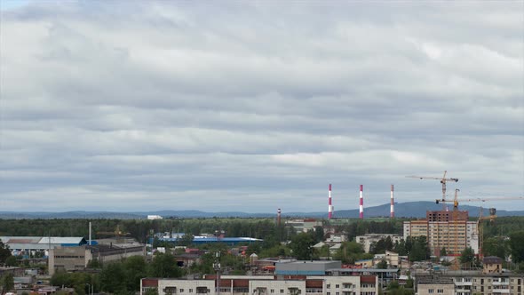 Clouds Moving on Sky Over Town