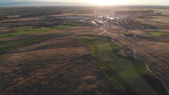 Aerial flight back to campground and golf course clubhouse in the early morning hours.  Lush, perfec