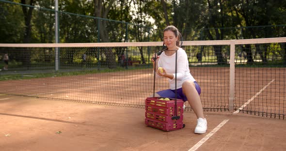 Woman Practise with Tennis Ball on Outdoor Court