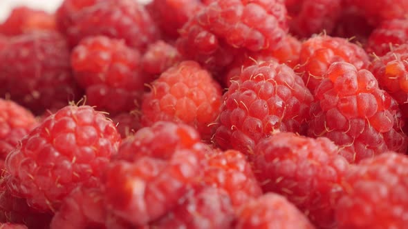 Natural vitamin and  antioxidant  Rubus idaeus  fruit background slow tilt 4K 2160p 30fps UltraHD fo