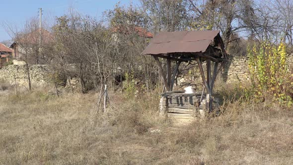 Water well house in the garden 4K drone footage