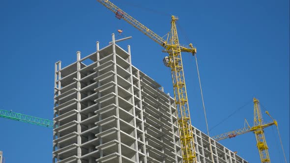 Timelapse Construction Site Crane Is Lifting a Precast Concrete Wall Panel To Installation Building