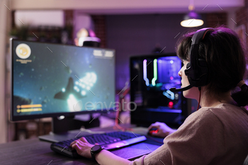 multiplayer tourney using cutting edge gaming system, captivating fans during live stream. Woman in rgb lights lit living room playing videogames