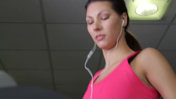 Female running on treadmills, cardio workout exercise in gym