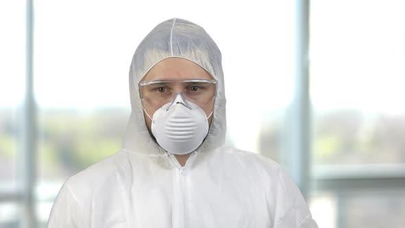 Portrait of a Man Wearing Protective Clothing with Mask