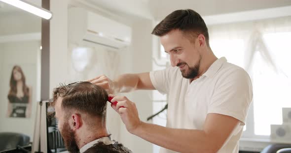Hairdresser Male Cutting Hair with Scissors Closeup