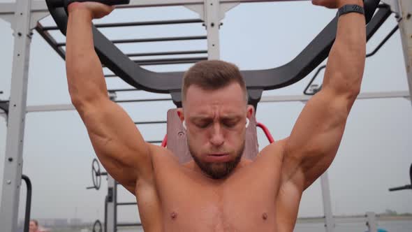 Muscular Man Exercising Outdoors