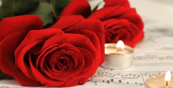 Red Roses and Candles on Sheet Music