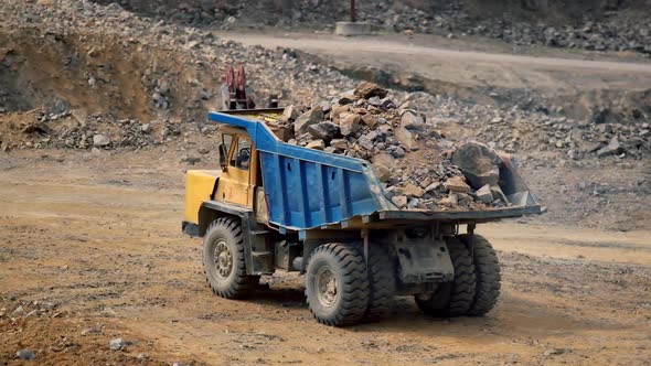 Big mining dumping truck. Mining truck in quarry road