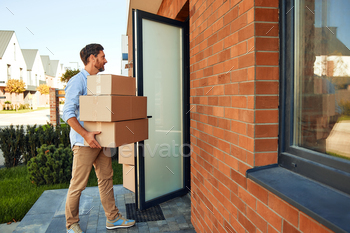  hands brings them into his new home. Renting and buying a home. Moving concept.