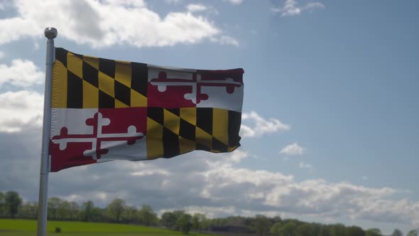 Maryland Flag on a Flagpole Waving in the Wind in the Sky