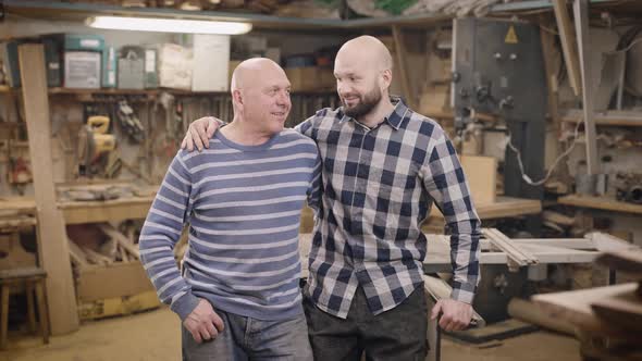 Father and Son in Their Family Carpentry Workshop