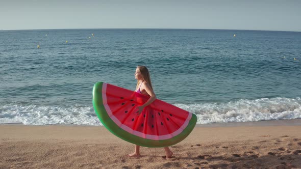 Beautiful Woman in Bikini Walking on Sandy Beach
