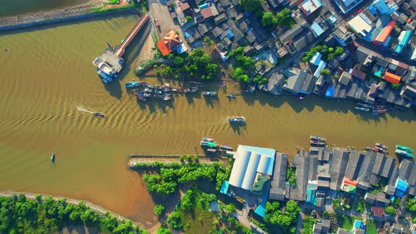 Drones are flying over Pak Nam Chumphon village during sunrise