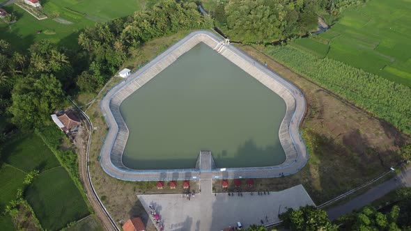 Aerial view of a reservoir with a puppet-like shape in the Bantul area, Yogyakarta