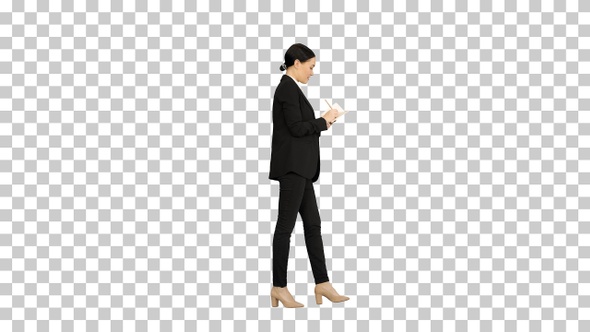 Concentrated woman in a suit writing business, Alpha Channel