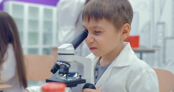 Pupil Looking Through Microscope at the Elementary School