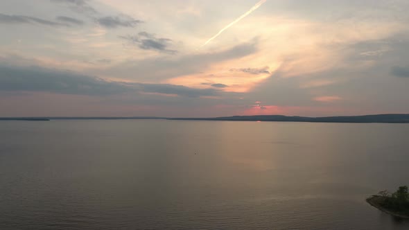 Sunset viewed by drone over the sea in bay with islands and pretty sky
