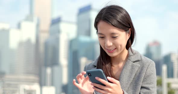 Business woman work on mobile phone at outdoor