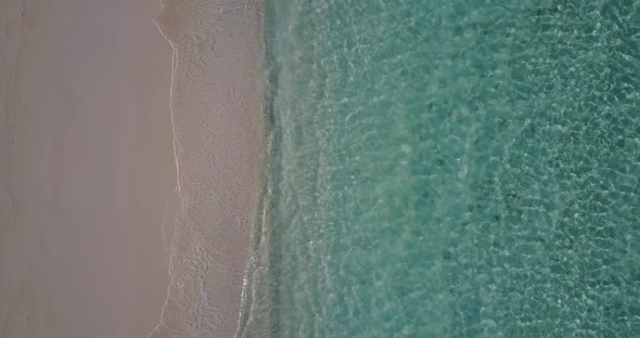 Luxury flying island view of a white sandy paradise beach and turquoise sea background in colourful 