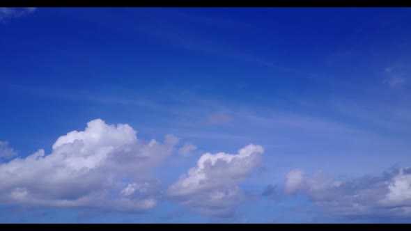 Aerial flying over scenery of paradise bay beach break by clear water and white sandy background of 