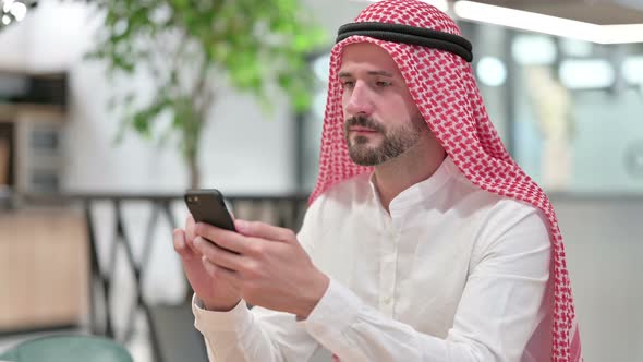 Text Messaging, Arab Businessman Using Smartphone
