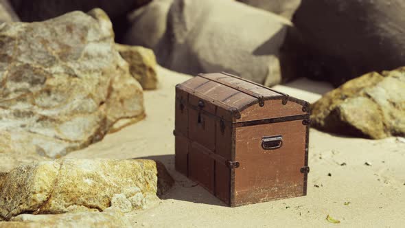 Treasure Chest in Sand Dunes on a Beach alt