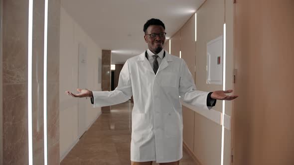 Happy Black Doctor Dancing in Corridor