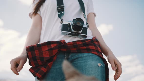 Female Tourist with Wintage Camera. Lov Angle No Face Shot