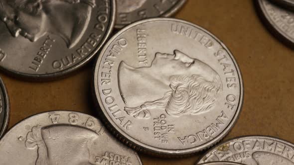 Rotating stock footage shot of American quarters (coin - $0.25) - MONEY 0233