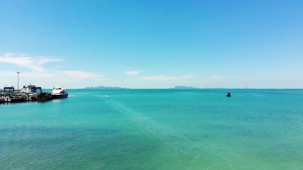 Drone flying out at sea from tropical paradise Koh Samui