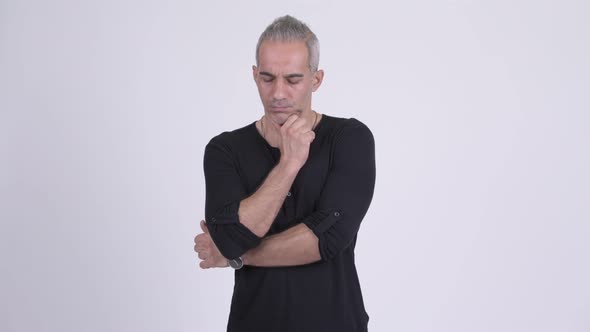 Serious Persian Man Thinking Against White Background