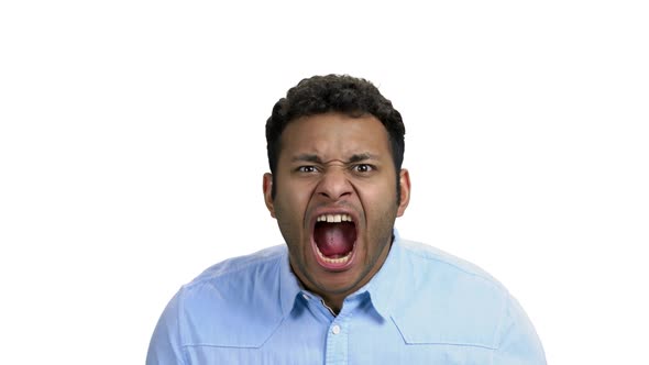 Crazy Darkskinned Man Yelling with Agressive Expression