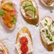 Variety of Small Sandwiches with Cream Cheese Vegetables and Salami - VideoHive Item for Sale