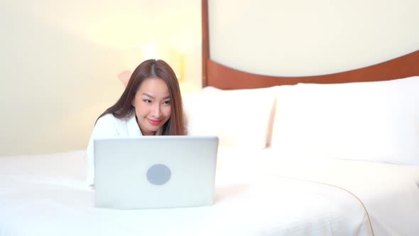 Young asian woman use laptop