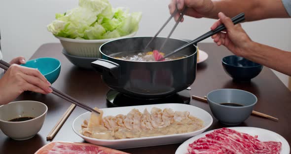 Family having hot pot together at home