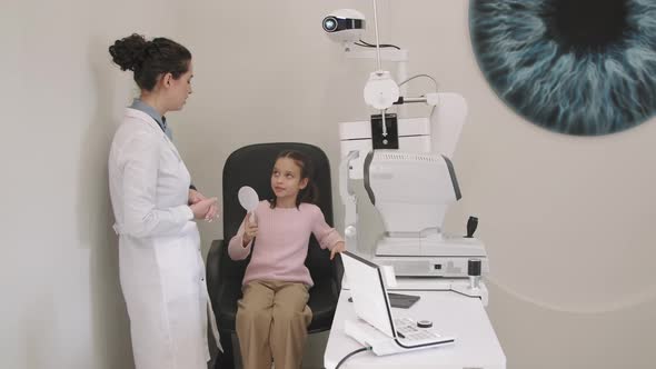 Girl At Optometrist Appointment Doing Eye Checkup