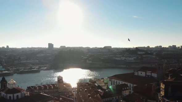 Panoramic view of Ribeira and Douro River with sunbeam. Oporto, Portugal