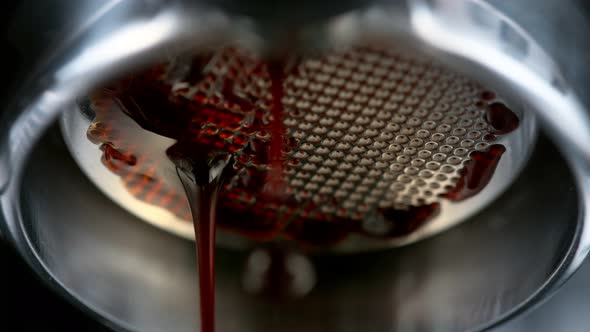 Super Slow Motion Macro Shot of Dripping Fresh Espresso Coffee From Lever Machine at 1000 Fps