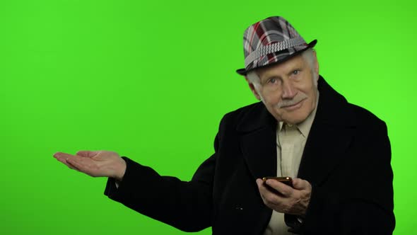 Elderly Grandfather Man Using Smartphone, Pointing at Something with Hand