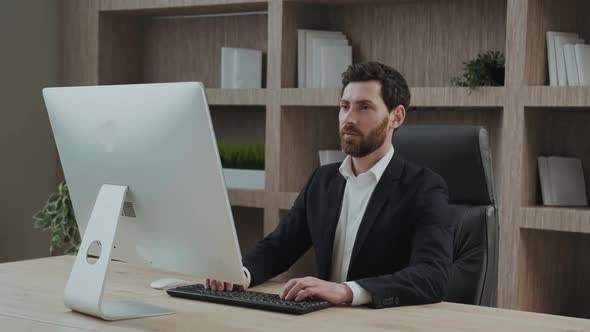 Satisfied and Relaxed Executive Feels Relieved at His Workplace