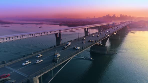 Aerial View of Sunset in a Big City on the River