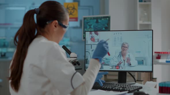 Woman Scientist Meeting with Expert on Online Video Conference