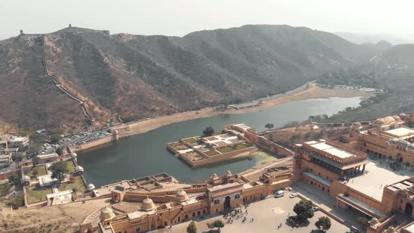 Maota Lake overlooked by Amber Fort embellished with Kesar Kyari Garden in Jaipur, Rajasthan, India