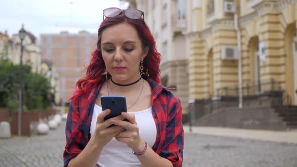 Red Hair Girl Use Blue Smartphone