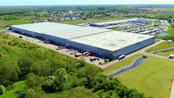 Aerial view of warehouse storages or industrial factory or logistics center from above. Top view of