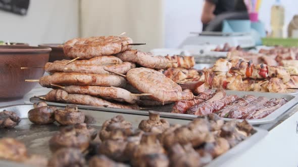 Ready-to-Eat Grilled Meat in a Street Food Shop Window. Ready-made Food on Party