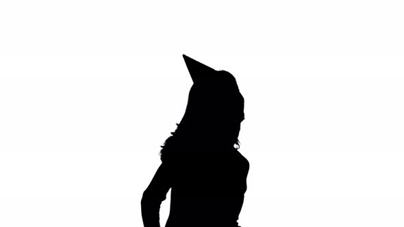 Girl in Cap Dances at a Party . White Background. Silhouette