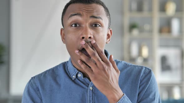 Portrait of Amazed Surprised Young African Man Wondering