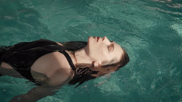 The Woman Swims in the Pool